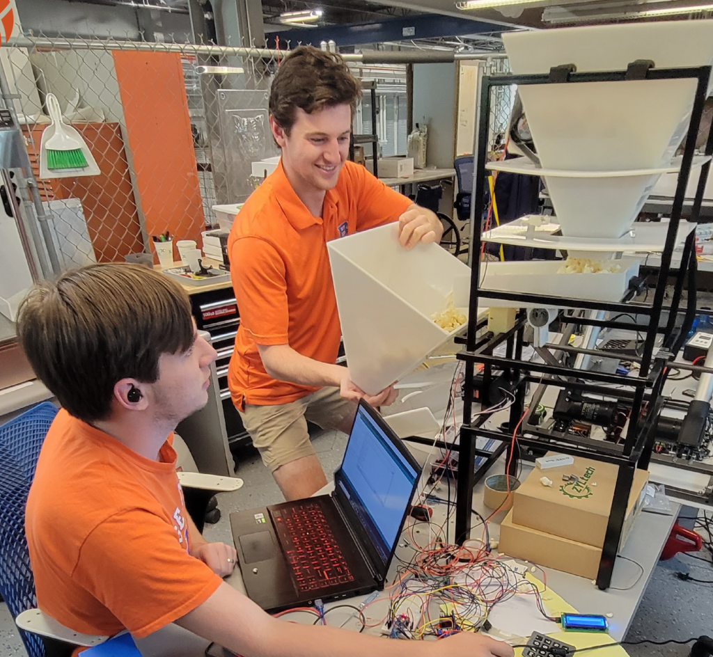 New Product Development Lab engineers developing a peanut auto hopper